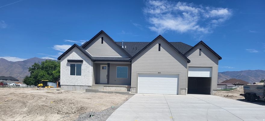 MAY MOVE IN!!!!   RILEY PARK IN ERDA 1 ACRE LOTS. By appointment only.  This home is under construction for a MAY completion.  This amazing OAKLEY floorplan sits on 1 full acre in Erda Utah. The main floor owner's suite has it all: tray ceiling, large walk-in closet, double undercounter sinks, soaker tub and oversized shower. Get cozy in the large family room around the fireplace. The open concept kitchen includes a large island for food prep/counter seating, a large walk-in pantry, kitchen with gas cooktop, 42" upper cabinets w/ crown molding, 30" Single sink, upgraded cabinet with dovetail, soft-close features. Laminate floor throughout the kitchen, dining, & family room. Quartz countertop in kitchen and bathrooms, Powder room located next to the garage entry and mud room bench. Stair railing with newel posts. Home includes unfinished basement with 9' foundation walls, room for a large family room, 3 additional bedrooms, a bathroom, and under porch storage. 95% efficient furnaces, 50-gallon water heater, & plumbed for a soft-water system. 3-car RV garage with 12' x 10' door and extra space on the side of the garage to add an RV pad. Ask me about our generous home warranties, active radon Mitigation System, and Smart Home Package, which is included in this home. The actual home may differ in color, material, and/or options. Pictures are of a finished home of the same floorplan, and the available home may contain different options, upgrades, and exterior color and/or elevation style. Square footage figures are provided as a courtesy estimate only and were obtained from building plans. No representation or warranties are made regarding school districts and assignments; please conduct your own investigation regarding current/future school boundaries.