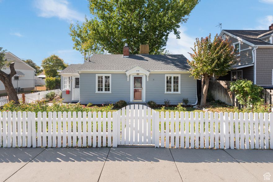 Charming Cape Codstyle home with a storybook feel and a private backyard retreat! Inside, you'll find warm butcher block countertops, a cozy gas fireplace, and formal dining room. And yes, your king size bed fits here! Mudroom entrance and basement are perfect for storage and organization! Enjoy quiet moments on your patio from the primary suite's private access. You'll love evenings with friends under the pergola and tree canopy. The white picket fence and tall fruit trees create a true New England vibe, complemented by mature rosebushes, grapevines, and even a chicken coop with access from the functional garage. Nestled in a lovely neighborhood - this home is full of character, creativity, and heart. Conveniently located less than 1 mile from freeway access; 13 minutes to SLC International Airport. All information provided deemed reliable; Buyer/Agent advised to verify all.
