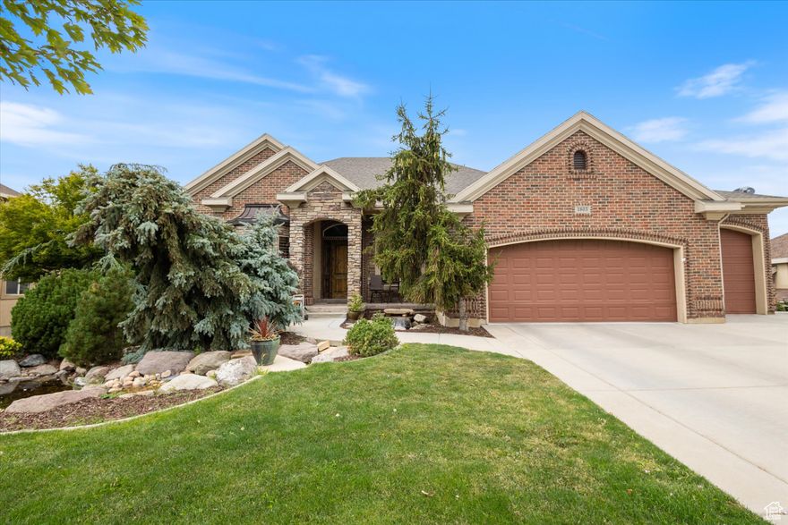 PRICED TO SELL! Discover the pinnacle of sophisticated living in the exclusive Canyon Oaks Subdivision. This meticulously crafted home offers breathtaking, unobstructed panoramic views of both the mountains and valleys from every vantage point. Seamless main floor living including a gourmet kitchen with custom cabinetry, a grand island measuring 10' long, double ovens, a convenient pot filler, and two dishwashers making entertaining effortless. The master suite provides a serene sanctuary, featuring stunning views and a cozy fireplace. Beyond the main level, a daylight basement with impressive 13' ceilings provides a second laundry, a dedicated craft room with a sink, and a suspended garage floor offering flexible storage or recreational space. This exceptional home prioritizes comfort and efficiency with two furnaces, two AC units, two water heaters, a water softener, and owned solar panels for sustainable living. For the automotive enthusiast, the expansive 5-car garage is a dream, boasting a deep third bay with a 10' high door  a truly rare find.