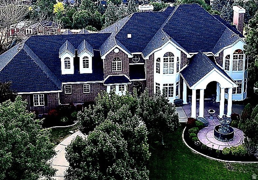 7-bedroom luxury estate with over 9,500 sq ft on a private cul-de-sac lot with unobstructed valley and mountain views. Original-owner, custom-built home designed for scale, flexibility, and multi-generational living-something rarely available in Logan.  There are homes that check boxes-and then there are homes that change how you expect to live.  Tucked at the end of a quiet cul-de-sac, this home was built with intention from the beginning-designed for space, privacy, and the ability to live without compromise. Natural light fills expansive living areas, creating a setting that works just as well for large gatherings as it does for quiet evenings.  The fully finished lower level, complete with a second kitchen, creates a true secondary living environment-ideal for extended stays, multi-generational living, or private guest space.  Upstairs offers a substantial bedroom layout with flexible spaces that adapt as life changes. Outside, multiple decks and patios capture the surrounding views, while the circular driveway, 4-car garage, and mature landscaping create a strong sense of arrival and privacy.  Buyer to verify all information, including square footage and bedroom count.