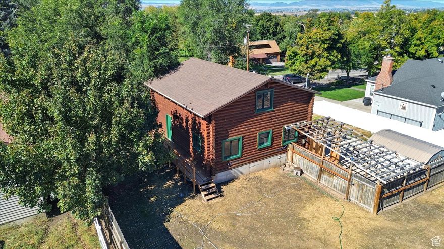 Imagine stepping into your very first home-a cozy log cabin-style house in the quiet, friendly town of Richmond, Utah. It's got that warm, rustic feel like something out of a storybook, but with all the basics you need to start building your life there. With 4 bedrooms and 2 bathrooms, there's plenty of room for you, your family, or even some roommates if you're just getting started. The main bedroom is a real standout-it's big and comfy, with a huge walk-in closet that's perfect for all your stuff. Those cool log stairs give the place a unique, handmade vibe that you'll love showing off. And don't worry about the weather; it's got central air and a solid furnace to keep things just right all year long. Out back, the yard is fully fenced for privacy and pets, with a spacious deck that's begging for your first barbecue or morning coffee spot. There's even a firepit ready for s'mores and stargazing nights with friends. Sure, it could use some fresh flooring, but that's where it gets exciting for first-time buyers-the sellers are throwing in a generous allowance if you make a solid offer, so you can pick out exactly what you want and make it feel like yours right away. This place has so much heart and potential; a little TLC, and it'll be the perfect starter home where you can create memories and build equity. If you're ready to dive into homeownership, this could be the one-let's chat about making it happen! Square footage figures are provided as a courtesy estimate only and were obtained from county records. Buyer is advised to obtain an independent measurement.