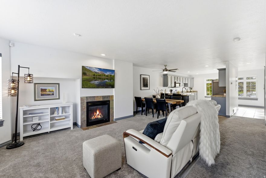 Ideal location in the valley this home beautifully balances comfort, style, and convenience.  Priced to sell quickly .  The spacious kitchen features granite countertops, modern cabinets with plenty of storage.  The large window in the kitchen allows for amazing natural light & a peaceful feel looking our the window. Enjoy a cozy fireplace in winter, a large primary suite with walk-in closet, and a luxurious ensuite with jacuzzi tub and separate shower. The lower-level flex room is great space for a small guest bedroom, office, workout space or extra storage. The oversized garage includes a sink and storage room. Brand new high end washer & dryer in 2022.  Water filtration system included.  Long term rentals are allowed. Utilities are low.   Convenient park next door, friendly neighbors,  close to shopping, dining, Holladay Rec Center and more.  Easy quick access to downtown Salt Lake, Park City, and several canyons for year-round recreation.