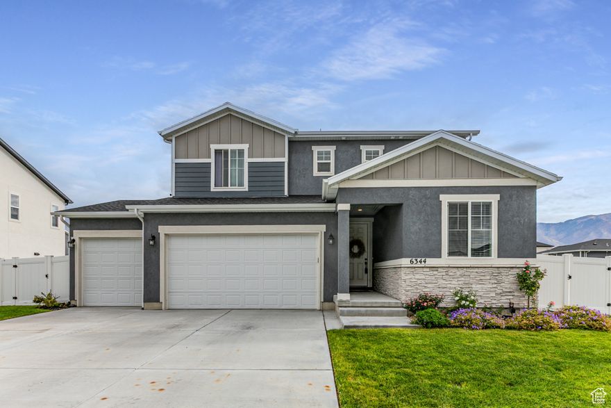 Don't miss this better-than-new opportunity to own in Stansbury Park! This gorgeous home is loaded with upgrades and move-in ready! Featuring beautiful LVP flooring throughout the main level and elegant quartz countertops, the kitchen and living spaces shine with style. A convenient flex room and  bath on the main floor make a perfect home office or guest suite.  The fully finished backyard is an entertainer's dream-enjoy a spacious patio, lush grass area, and complete landscaping with full fencing. Relax and take in the unobstructed mountain views right from your backyard. Plenty of room for toys with RV parking and a 3-car garage! Bathrooms include stylish tile floors, adding another layer of quality to this thoughtfully designed home.
