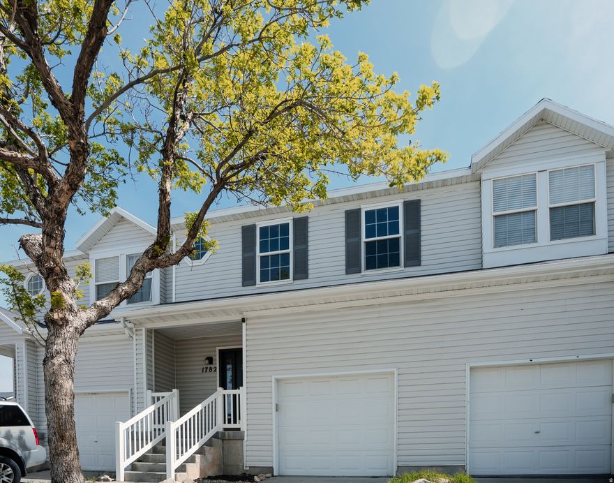 Spacious 4-bedroom, 2-bath townhome in the heart of Tooele with over 2,000 sq ft across three levels. Freshly painted with professionally cleaned carpets, this home is move-in ready and offers a functional layout with a master bedroom and attached full bathroom. Basement was remodeled in 2024, providing flexible space for a second living area for kids or office and entertainment.  Enjoy a central location near local schools, a new shopping center, and Tooele's growing downtown with a community theater and local events. Outdoor recreation is just minutes away with nearby mountain trails.  HOA plans to install new roofs within the next year, adding future value and peace of mind. HOA fee is looking to be lowered once roofs are complete!