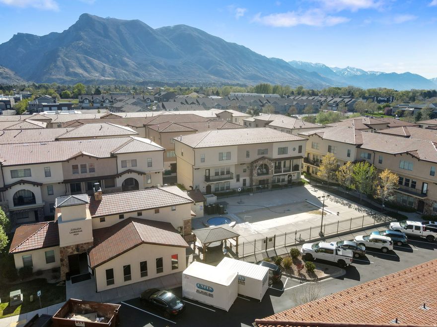 Welcome to this beautifully upgraded 3-bedroom, 2.5-bathroom townhome located in one of Highland's most desirable gated communities. Featuring brand new carpet throughout, this home offers an open, light-filled floor plan designed for both comfort and style. The main level showcases a spacious great room with wood beam accents, a statement brick wall, 9-foot ceilings, and recessed lighting. The modern kitchen is equipped with quartz countertops, stainless steel appliances, and ample cabinet and pantry space. Step out onto the private balcony, perfect for relaxing or grilling. Upstairs, the primary suite offers a true retreat with vaulted ceilings, an oversized vanity, and a large walk-in closet. The lower level provides a versatile office or flex space to fit your needs. Enjoy exceptional community amenities including a heated pool and spa, hot tub, fitness center, theater room, clubhouse with full kitchen, outdoor gazebo with grill, and more. Located just minutes from American Fork Canyon with easy access to hiking and outdoor recreation, and within walking distance to parks, trails, splash pad, and shopping. Low-maintenance living in an unbeatable location.  Square footage figures are provided as a courtesy estimate only and were obtained from county records.  Buyer is advised to obtain an independent measurement.
