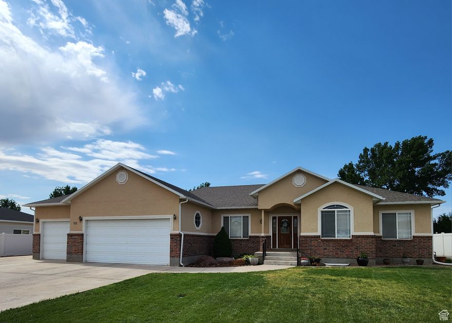 This home is a must see! Newly remodeled and move in ready. The backyard is adjacent to a well cared for grass field and on a dead end street. Inside the home there are new and updated kitchen counters, faucets, lights, carpet, blinds, luxury vinyl planking, and stainless steel appliances. There is also water softener. Grapes and raspberries are coming on in the fall. Pear, peach, and cherry fruit trees line the back yard. Plenty of storage including two large storage rooms. The master bedroom is on the main floor as well as two bedrooms and a laundry room. Downstairs there are three bedrooms and a large family room. The carpet is brand new. The neighbors are friendly and helpful. Besides the three car garage there is room to park an RV. Plumbed for a second kitchen if desired.  Square footage figures are provided as a courtesy estimate only and were obtained from tax records.  Buyer is advised to obtain an independent measurement.
