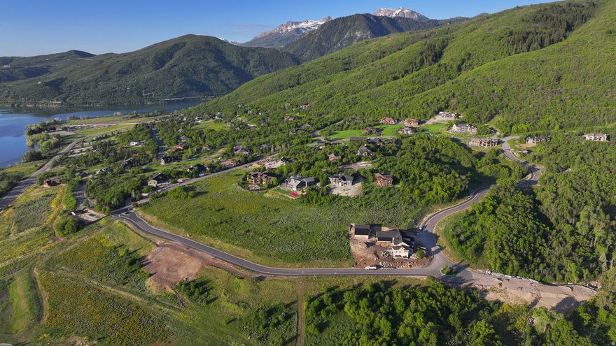 Set high above Pineview Reservoir, this exceptional homesite in Eden captures panoramic views of the valley below and the surrounding mountain peaks. Located within an exclusive enclave of just 24 carefully designed lots-ranging from 1 to 1.56 acres-this property offers a rare opportunity to create a modern mountain retreat surrounded by unspoiled natural beauty. Here, tranquility and adventure exist in perfect balance. World-class skiing at Snowbasin Resort and Powder Mountain is less than 20 minutes away, while Nordic Valley is just a quick nine-minute drive. In warmer months, nearby trails burst into color with wildflowers, and North Arm Beach-located just across the street-offers easy access to boating, paddleboarding, fishing, and relaxing lakeside afternoons. More than simply a homesite, this is your gateway to elevated living in one of Utah's most spectacular mountain landscapes. All property information, boundaries, and documents are to be verified by the buyer.