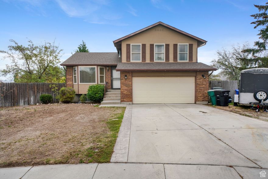 Come see this wonderful West Jordan home nestled on a quiet cul-de-sac, offering a spacious layout with 4 bedrooms and 1.5 bathrooms across 1,852 square feet. The main level provides ample space for gathering with both a formal living room and a cozy family room complete with a fireplace. Upstairs you will find two bedrooms, a full bath, and the laundry area, while the 100% finished partial basement adds incredible flexibility with two additional bedrooms. Situated on a generous 0.25-acre lot, the property features full landscaping and a patio perfect for outdoor enjoyment. This home also includes an attached 2-car garage and the comfort of forced air heating and an evaporative cooler. Enjoy the convenience of additional parking behind the south-side fence, plus peace of mind knowing the asphalt shingle roof was replaced just three years ago. Best of all, enjoy the freedom and savings that come with having NO HOA.