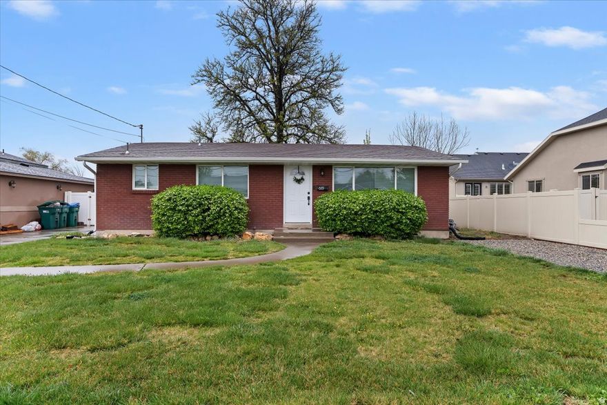 Move-in ready two-kitchen home located near both UVU and BYU! This property offers a great investment opportunity, featuring a basement apartment with its own full kitchen. The upstairs kitchen was fully remodeled in 2025 with new countertops, cabinets, gas stove, range hood, porcelain sink, faucet, LVP flooring, and fresh paint. Additional updates include newer windows, remodeled main level bathroom, a newer A/C unit, and added attic insulation for improved energy efficiency (2024). Outside, there is plenty of parking with a 2-car covered carport and an RV pad on the east side of the home. The fully fenced backyard features beautiful mountain views and a variety of fruit trees, including pear, cherry, apple, apricot, peach, blackberry, and raspberry. Additional storage is available in the carport and shed. Located within 1.5 miles of both universities, this home is also close to shopping, dining, and University Place Mall.