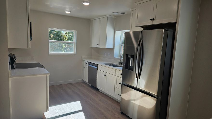 Beautifully remodeled apartment, clean white very bright. Refrigerator, stove, microwave, dishwasher, washer and dryer included.  Central air and heat.
