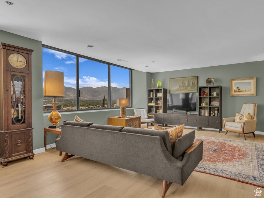 This house comes with a REDUCED RATE as low as 5.625% (APR 5.889%) as of 10/21/2025 through List & Lock. This is a seller paid rate-buydown that reduces the buyer's interest rate and monthly payment. Terms apply, see disclosures for more information.  Custom remodel showcases this 16th floor corner condo. Optimal location in the south tower allows for spectacular city, mountain, & valley views. Spacious new kitchen was designed with sleek lines & bold colors. Primary suite is currently used as a sitting/study room with ridiculously inspirational views. It has an attached 3/4 bath with updated fixtures & lighting. Full bathroom updated with fresh fixtures & lighting as well. Second bedroom is being used as an owners retreat, has a large & updated walk-in closet. High end custom shades adorn the expansive windows throughout this home. Karastan BelleLuxe Laminated Wood Flooring throughout & is waterproof! Washer, dryer, & all new kitchen appliances included. Ideal city living just steps from Main St. offers walkability & the ease of Trax and bus system. American Towers has recently updated many amenities. Facial recognition entrance with 24-hour onsite security staff & underground parking space w/ room for storage, bike storage and a car wash! New indoor swimming pool and elevators. Amenities include sauna, racquetball court, gym, billiards room, library, clubhouse w/ full kitchen to hold parties, rooftop hot tub, barbecue grills, patio lounging and endless views.