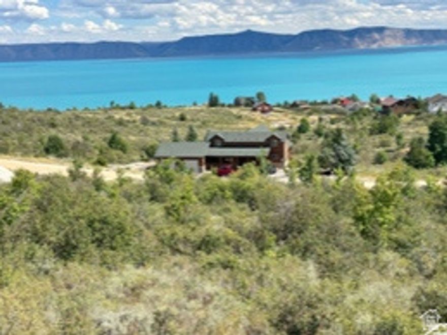 Make your move to Bear Lake, this building lot has stunning views, mature trees, gradual sloped lot to keep your forever view of Bear Lake. Lot is improved with stubbed culinary water, sewer & power. Lot was surveyed corners were in evidence. Enjoy the amenities of 9 home golf course, with owner discount, Bear Lake Access, tennis/ pickleball court, summers outdoor heated pool for owner. NO Short term rentals allowed in this HOA.