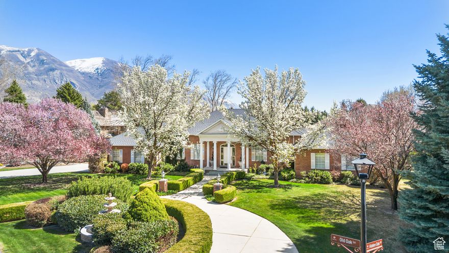 1% rate buy down with use of the preferred lender (see attached flyer for details). Discover timeless elegance and exceptional craftsmanship in this distinguished residence located in the coveted Hidden Oaks community. Set on a meticulously landscaped 0.46-acre lot, this 5,548 square foot estate offers a rare combination of sophistication, comfort, and privacy.  Thoughtfully designed for seamless main-floor living, the home features five spacious bedrooms and five well-appointed bathrooms. A grand marble entry welcomes you into the heart of the home, where refined finishes create an atmosphere of understated luxury.  The kitchen is equipped with granite countertops, custom cabinetry, and generous prep space-ideal for both everyday living and entertaining. A formal living room offers an inviting space for intimate gatherings, while the dedicated office provides the perfect environment for focused productivity.  The main-floor primary suite is a private retreat, complete with ample closet space. Upstairs and down, additional living areas offer flexibility for guests, media, or recreation.  A 3-car garage, mature landscaping, and the prestige of Hidden Oaks complete this exceptional offering. Rarely does a home of this caliber become available in one of Highland's most desirable neighborhoods.