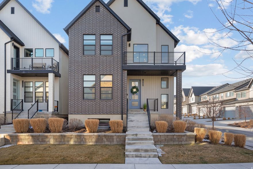 Four outdoor spaces? Two balconies AND two porches? In Lehi? Yeah, we need to talk about this house. This isn't your standard builder-grade listing. This is an Ivory Homes Bergen Grand with 3,100+ sq ft of SLEEK, modern finishes, and honestly, it's kind of ridiculous (in the best way). Here's what you're getting: 3 bed (could add a 4th) + flex room, 2.5 bath, 3,100+ sq ft; Primary suite with vaulted ceilings, walk-in cultured marble shower, dual sinks; 2 balconies upstairs + 2 porches = outdoor space for DAYS; Fully finished basement = bonus room for literally whatever (game room, gym, movie nights - you decide); Chef's kitchen: gray shaker cabinets, white quartz, stainless everything; EV charger in the garage (because yes); Tankless water heater, water softener, reverse osmosis, radon mitigation - it's ALL here! LOCATION? Off 2100 N, minutes from I-15, Redwood, Mtn View Corridor, and the new Primary Children's Hospital. You're close to everything without being ON everything. This is the kind of home that checks every box you didn't even know you had. Schedule a showing today! Buyer to verify all. Square footage figures courtesy of Utah County.