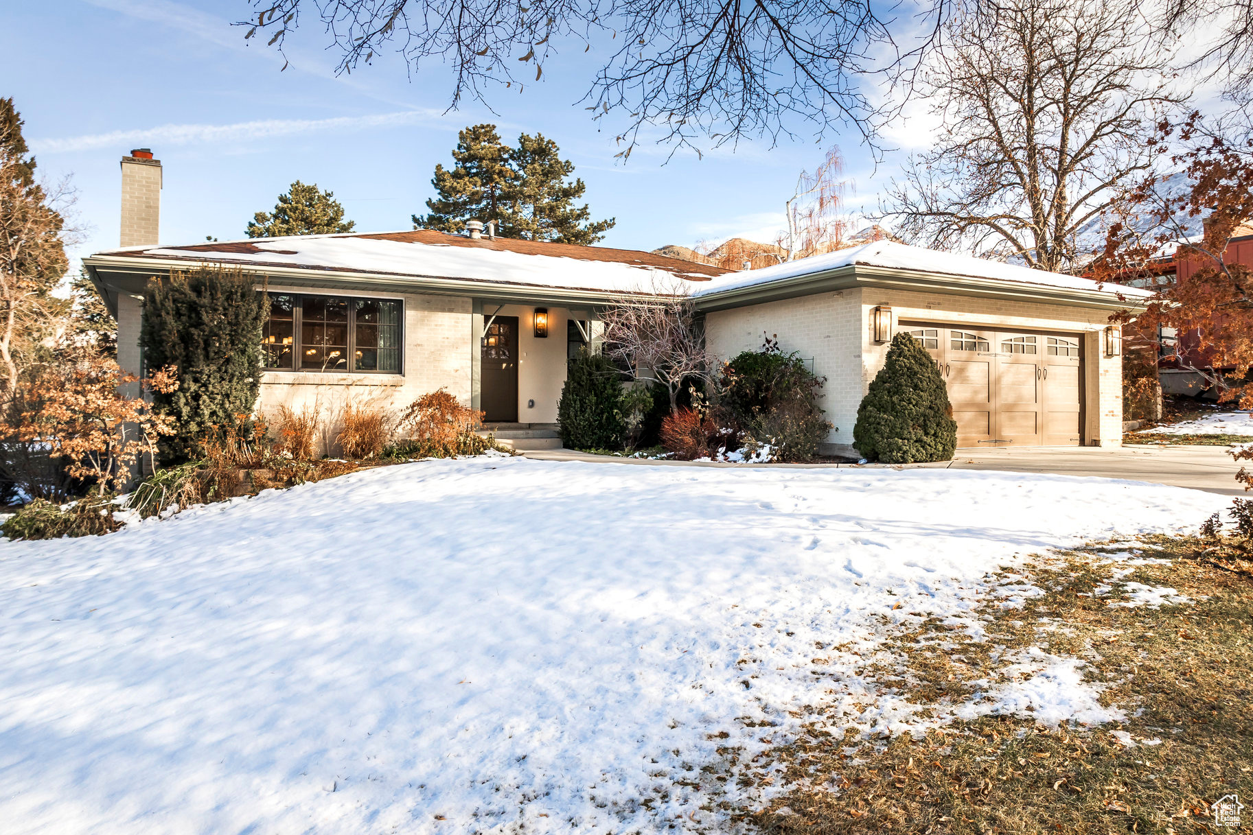 Experience luxurious living in this newly remodeled, European-inspired ranch home in the highly sought-after Country Club neighborhood-just a short walk to the golf course! Every detail has been thoughtfully upgraded, blending timeless design with modern comfort. The chef's kitchen is a showstopper, featuring custom white oak cabinetry, marble countertops, a ZLINE dual-fuel range, KitchenAid refrigerator, Bosch dishwasher, a cozy breakfast nook, and a stylish drink bar. Designed for entertaining, the home offers two spacious family rooms, a theater flex room with a wet bar, and a covered deck prepped with hot tub hookups. The expansive, level backyard provides endless possibilities. The elegant primary suite boasts a dual shower, soaking tub, marble finishes, and a private laundry area. Additional highlights include ensuite bedrooms on both levels, an extended pantry and or mud room, and two laundry rooms for ultimate convenience. Elegant touches throughout the home include engineered hardwood floors, marble countertops and tile, natural stone accents, wool carpet in the lower-level bedrooms, and a charming Dutch front door. Abundant natural light fills both levels of the home, enhancing its warm and inviting atmosphere. Located just minutes from the University of Utah, Downtown Salt Lake City, and less than 20 minutes to Park City. Nestled on a tree-lined street in a well-established, peaceful neighborhood, you'll enjoy easy access to I-80 and I-215. Plus, the vibrant new "TWENTY ONES" (21st and 21st development) is just around the corner, offering walkable access to shopping, dining, and more. With the mountains and canyons nearby, endless biking, skiing, and hiking adventures await right outside your door. Additional upgrades include a new furnace, on-demand water heater, and AC (all installed June 2024), along with brand-new PEX plumbing, electrical wiring and panel, HVAC, windows, insulation, and an epoxy-coated garage floor. Don't miss this rare opportunity-schedule your private showing today! A Signature Design by Seventh & Stone.