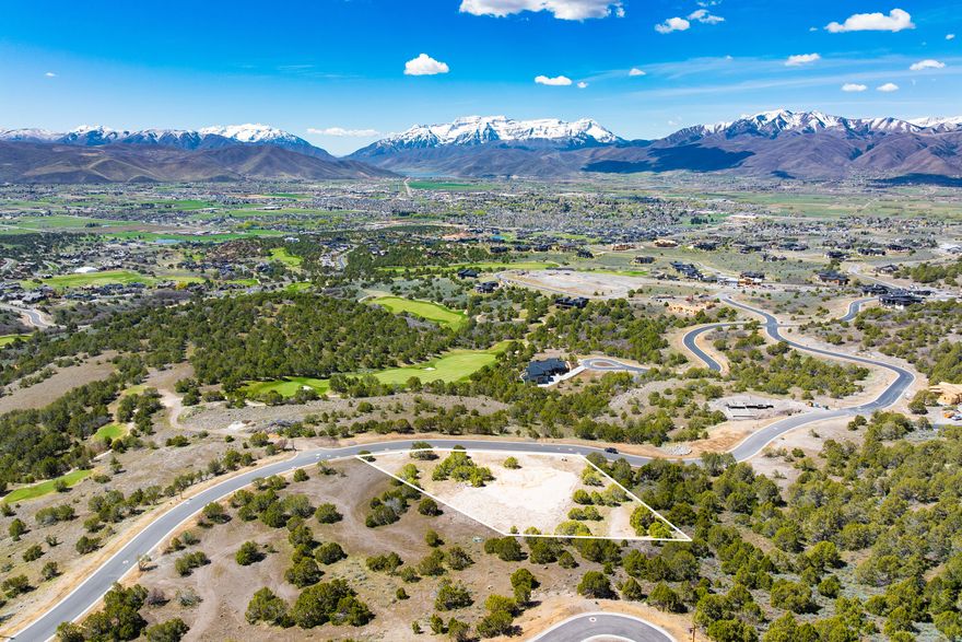 Positioned in a premier location within Red Ledges, Lot 911 is an exceptional 0.94-acre homesite offering breathtaking, panoramic views of Mount Timpanogos and the surrounding Wasatch Back. This property captures the essence of elevated mountain living with sweeping vistas that stretch across the valley and over the award-winning golf course.  Ideally situated near the future clubhouse location, this homesite offers both convenience and long-term value, placing you at the heart of Red Ledges' continued growth and amenity expansion. Enjoy stunning sightlines of the meticulously maintained fairways, creating a dynamic backdrop that blends natural beauty with refined design.  With ample space to design and build a custom mountain retreat, Lot 911 provides the perfect canvas for luxury living in a private, gated community. A Golf, Golf Park, or Lifestyle Membership is available with this homesite, offering access to world-class amenities including championship golf, tennis, fitness, dining, and year-round outdoor recreation.  This is a rare opportunity to secure one of the most view-centric and well-located homesites in Red Ledges.