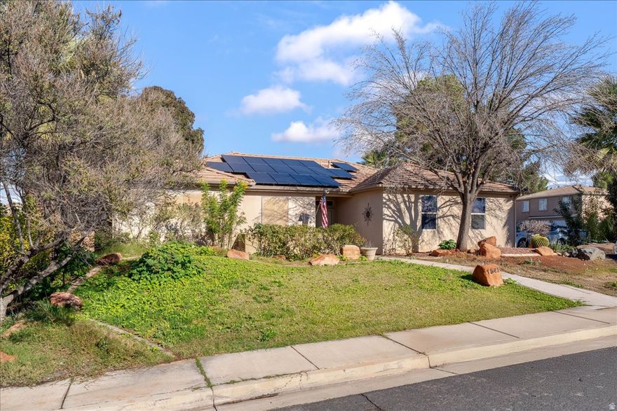 Welcome to Royal Oaks, where comfort meets convenience in this spacious 3 bedroom, 2 bathroom single-level home. Thoughtful updates and generous room sizes create a home that feels both functional and inviting from the moment you step inside. The bright living area features large windows and stylish flooring that adds character and warmth. The adjoining dining space offers room to gather, with easy access to the backyard for indoor-outdoor living. The kitchen delivers plenty of countertop space, crisp white cabinetry, and updated lighting that keeps the heart of the home feeling fresh and open. All three bedrooms are generously sized, offering flexibility for guests, hobbies, or home office use. The primary suite sits privately apart and includes dual vanities and a large walk-in shower, creating a comfortable retreat at the end of the day. A second full bathroom serves the additional bedrooms with convenient functionality. The oversized laundry room is a standout with abundant cabinetry, folding space, and a utility sink. Outside, the property includes an insulated storage shed that adds valuable year-round utility. The home also features solar panels, helping reduce energy costs and improve efficiency. Located in the desirable Royal Oaks community, this home puts you near parks, schools, shopping, and everything St. George has to offer. Whether you're starting out, settling down, or searching for a smart investment, this property checks all the boxes for space, value, and potential. A great opportunity in a great neighborhood. Come see why Royal Oaks remains one of St. George's favorite places to call home.