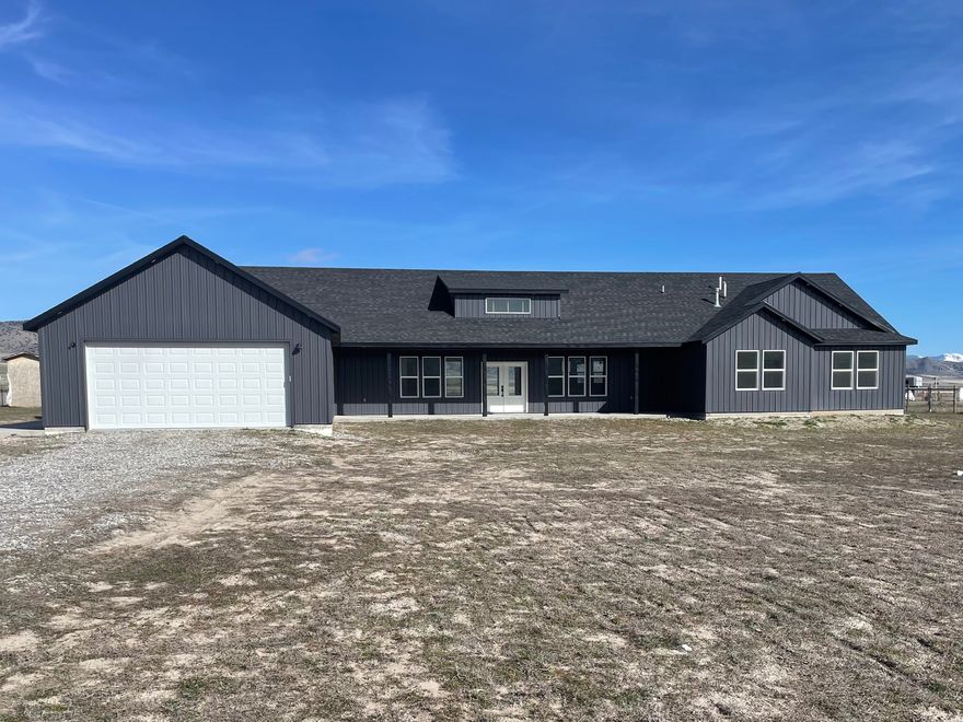 This beautiful 5-bedroom, 2.5-bathroom home offers 3,216 sq ft of living space on 3.13 acres which includes stunning mountain views. This home is fit for a king! It features extra-tall ceilings that create an open and airy feel throughout the main living areas.   The separate primary suite includes a private en suite bathroom, closet, AND laundry room, providing a quiet and comfortable retreat. This home definitely gives country living vibes, while still conveniently located close to schools and grocery stores.  Bring your animals! Square footage figures are provided as a courtesy estimate only and were obtained from county records. Buyer is advised to obtain an independent measurement.