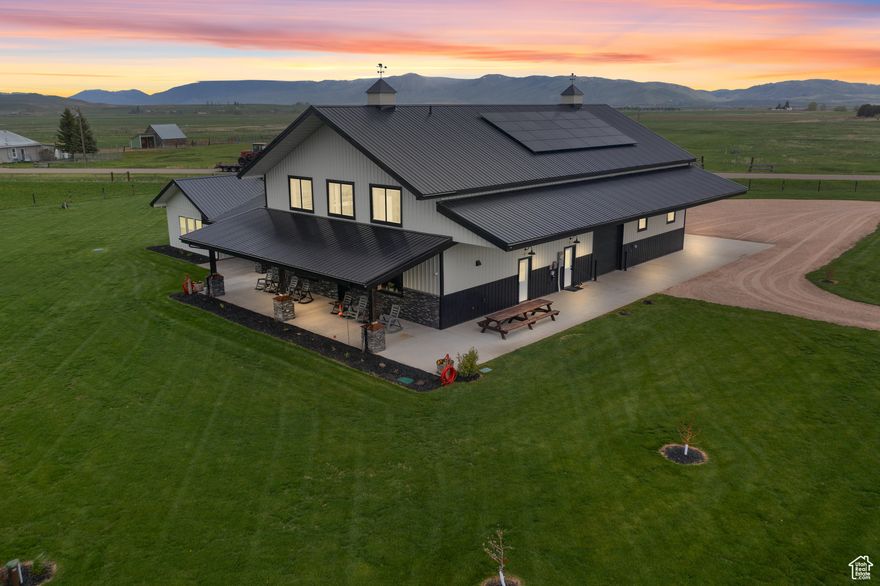 Experience quiet country living with modern comforts at 22 Old Ranch Rd in Ovid, Idaho. This beautifully designed 2,881 sq ft home features 3 spacious bedrooms, 3.5 baths, and a custom-built bunkroom with 5 bunks-perfect for hosting family and friends. Enjoy the warmth of a cozy pellet stove, custom cabinetry throughout, and the convenience of a wired sound system, security cameras, generator hookup, and hot tub-ready wiring. Solar panels offer energy efficiency, and two RV hookups add flexibility for guests or outdoor adventure. Take in stunning mountain views in every direction from this peaceful, private setting, just 15 miles from North Beach. The 1,920 sq ft heated shop is ideal for storage, hobbies, or workspace. Whether you're seeking a full-time residence, vacation retreat, or investment opportunity, this property combines quality craftsmanship, modern utility, and serene living in one rare offering.