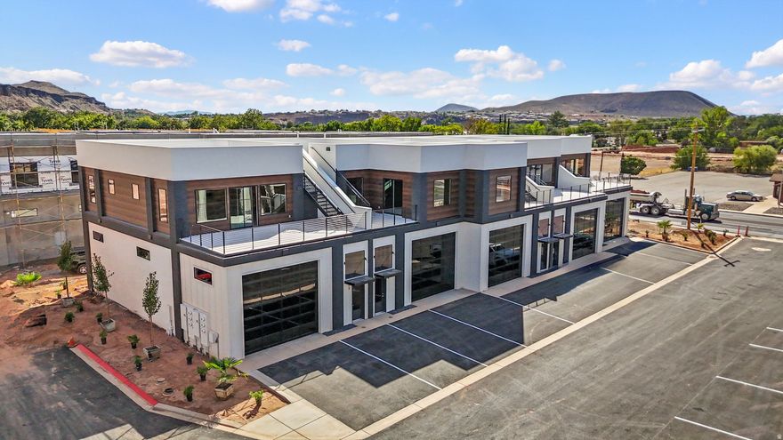 These versatile flex spaces offer a unique opportunity to live/work in one of southern Utah's fastest growing areas. Strategically located near Zion National Park & bustling with potential, these modern, customizable spaces are perfect for entrepreneurs, creatives & businesses seeking a dynamic environment to thrive. With a blend of small-town charm & proximity to major hubs, these properties are ideal for those looking to secure a foothold in an up-and-coming community. Units are offered as a 'gray' shell with 1800 sf of garage space (14x16 garage door & 60-62 ft deep), 1600-1800 sf on the 2nd level for living and/or office space, storage, etc., 300 sf of mezzanine & 800 sf of structurally supported rooftop patio. HOA $125/mo & includes a putting green.  Several units available to purchase. Price will vary based on unit. Build-out/improvements will be the responsibility of each owner.  Square footage is approximate. Owner/Developer is a licensed Utah agent.