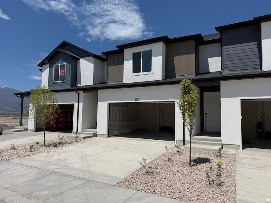 Early-phase opportunity with builder incentives currently available. Pricing subject to change as community releases progress. Secure opportunity early. Modern 2-story townhome offering elevated design, and functionality. 3 bedrooms | 2.5 baths | 2-car garage | 20' enclosed backyard. Open-concept main level designed for connection, comfort, and everyday flow. Bright interior with 9' ceilings, oversized windows, 8' doors, waterproof LVP flooring, contemporary trim, and matte black hardware throughout. Buyers rave about the kitchen-quartz countertops, 42" custom cabinetry, soft-close drawers, pull-out shelving, and oversized single-bowl sink. Feels both refined and functional. Upstairs layout creates separation between living and rest. Private primary suite features walk-in closet, double vanity, quartz surfaces, and modern glass shower enclosure. Secondary bedrooms positioned for flexibility, office space, or evolving lifestyle needs. Included features elevate the experience from day one: Lennox high-efficiency furnace and A/C, Honeywell Wi-Fi thermostat, smart lock entry, MyQ garage system, EV/charging outlet location, upgraded lighting, ceiling fans, Cat-6 wiring, and added electrical outlets throughout. Exterior combines Amsco windows, stucco, and James Hardie accents for lasting durability and curb appeal. Designed above standard from the start. Call agent for incentives and availability.   Square footage figures are provided as a courtesy estimate only and were obtained from builder plans.  Buyer is advised to obtain an independent measurement.