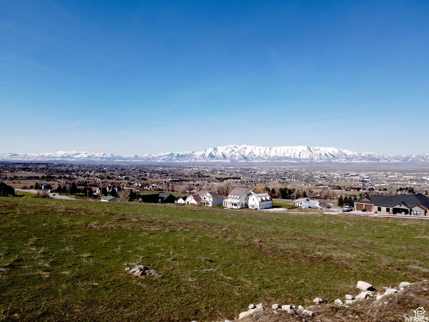 These land lots are now construction-ready with completed grading, essential dirt work, and building permits available. With all the groundwork done, you'll be able to start your project without delays, offering a seamless transition to build your dream home. Lone Cedar, a new community in Hyde Park City, offers stunning westward valley views and majestic eastward mountain scenery toward Hyde Park Canyon. This lot is 0.48 acres, with gentle slopes, providing versatile building options. Designed to foster an attractive community, Lone Cedar ensures ample space between lots and prioritizes water conservation with native, drought-tolerant landscaping.