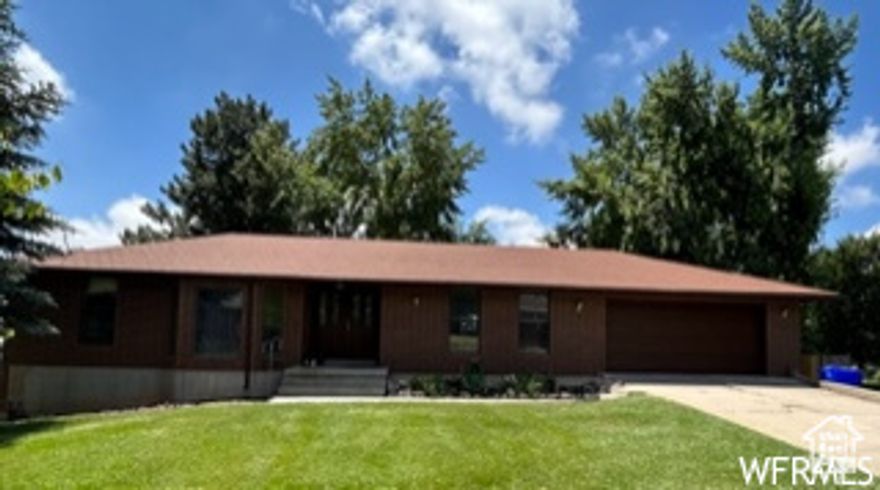 Back on Market! and price improved $20,000 for 5 bedroom, 2 full baths on 1/2 acre lot in cul de sac.  Gorgeous view of mountains  Home has newer downstairs carpet, paint, furnace and A/C.  Mother in law apt. Two driveways