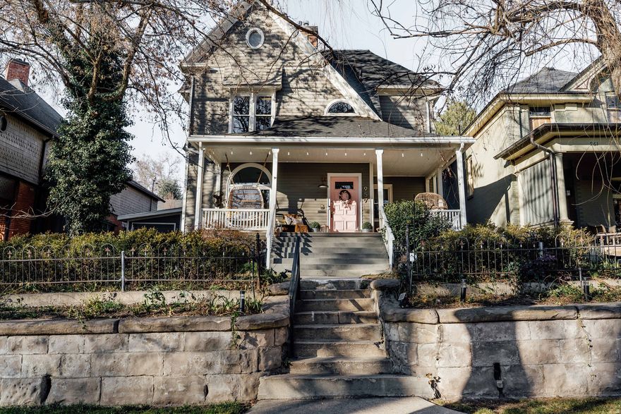 Don't miss your chance to own one of the Lower Avenues' most iconic historic homes. An rare 1891 Lower Avenues residence listed on the National Historic Register, offering nearly 5,000 square feet-an exceptionally rare size for the neighborhood. Fully restored from 2020 to 2025, this 6-bedroom, 6-bath home blends historic character with thoughtful modern updates throughout. A show-stopping original spiral staircase anchors the home, while soaring 12-foot ceilings and a remodeled kitchen with back pantry, wall ovens, sink, and coffee station elevate everyday living. The property includes a true mother-in-law apartment with 2 bedrooms, 1.5 baths, and a private walk-out entrance. Sold fully furnished, it has operated as a highly successful short-term rental for the past three years, offering excellent income potential or flexible living for extended family, guests, or students attending the University of Utah.  Upstairs features three bedrooms, including a primary suite with en-suite bath and fireplace, while the converted attic provides a beautiful bonus space or second primary suite. The remodeled backyard offers multiple patio areas, a pergola, and planter boxes, plus alley parking for three cars with room to expand the carriage house. Walkable to cafes, coffee shops, and neighborhood favorites. Please see upgrade sheet attached for a complete list of renovations and improvements.