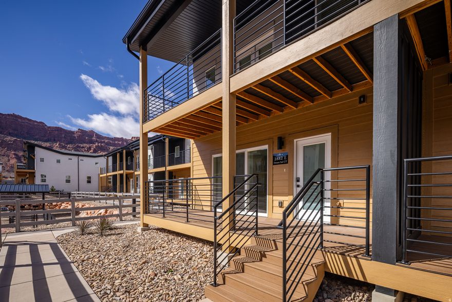 DESERT SOL - Welcome to Desert Sol Villas, an exceptional new luxury townhome community thoughtfully designed in Moab.  This 5 bedroom, 3.5 bathroom residence offers generous living space, modern finishes, and seamless indoor-outdoor flow that complements the surrounding red rock landscape. The open-concept layout features a well-appointed kitchen with quality stainless steel appliances, spacious primary suites, in-unit washer and dryer, and abundant storage to accommodate both everyday living and recreational gear. Expansive windows invite natural light while framing Moab's iconic scenery, creating a warm and inviting atmosphere throughout. Step outside to a private outdoor deck designed for taking in Moab's stunning red rock views and evening sunsets. Whether hosting friends, enjoying morning coffee, or unwinding after a day on the trails, the deck extends the living space and captures the peaceful desert setting. Community amenities include a dedicated dog park, offering space for pets to enjoy the outdoors close to home and ample parking is available for residents and guests. Located in a quieter area of Moab with convenient access to shopping, dining, and recreation, this home offers a balance of privacy and accessibility. Just minutes from Arches National Park and Canyonlands National Park, with easy access to hiking, biking, and the Colorado River, this is a rare opportunity to own new construction in one of Utah's most sought-after destinations. This unit is only offered to primary residents and local investors that qualify in the Moab area.  Up to $15,000 in Closing Costs incentives from the Seller and Preferred Lender!