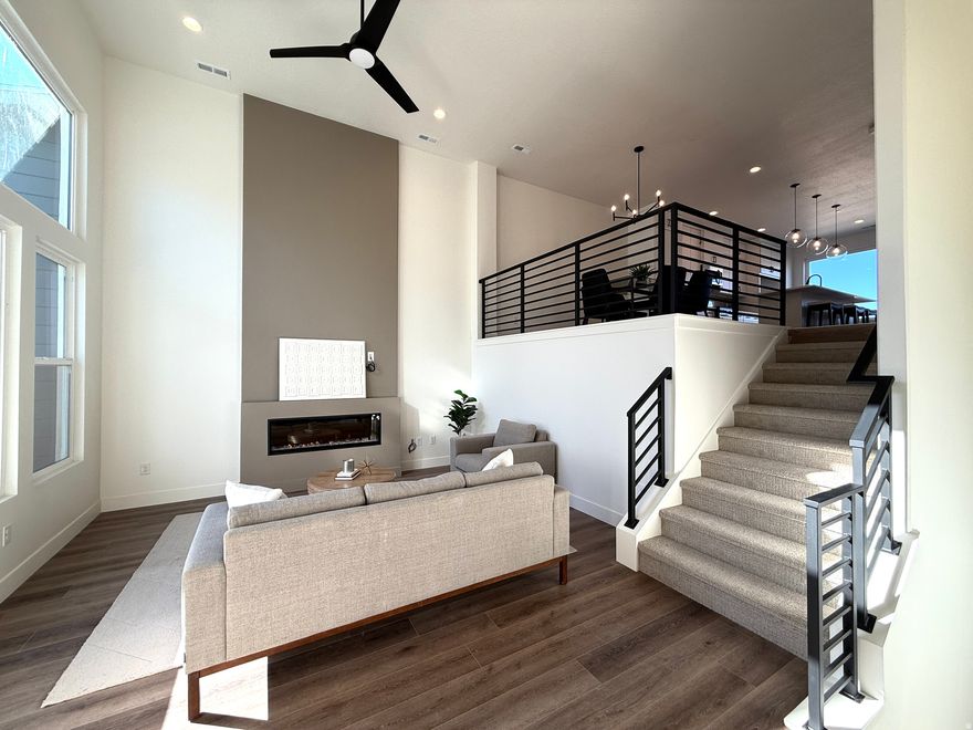 This unique townhome is designed with flexibility and modern convenience. On the main level enjoy a flex space with bath and separate heating/cooling system. Perfect as a private separate office from the rest of the home and is even permitted for commercial use. The second floor is where your main living area shines, featuring a kitchen with a large walk-in pantry, a dining area, and a living room that opens to an exterior deck. On the third floor, you'll find three bedrooms, a laundry room, and a stunning sky room with an upper deck on the fourth floor. This townhome is the perfect choice for those who work from home or want extra space.