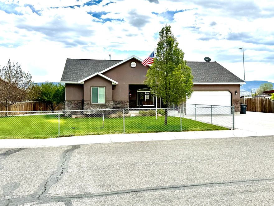 Welcome to this well maintained and thoughtfully designed home  offering space, comfort, and an ideal location. This fully finished residence features 5 bedrooms and 2 bathrooms and sits on a generous .38-acre fully fenced lot, providing both privacy and room to enjoy the outdoors. As you enter the home, you are greeted by vaulted ceilings that create an open and welcoming atmosphere in the main living areas. The home offers formal living rooms on both the main level and the basement, making it perfect for entertaining, multi-generational living, or simply enjoying separate gathering spaces. The layout is functional and spacious, allowing for flexibility to meet a variety of lifestyle needs. The kitchen is warm and inviting, complete with ample cabinetry and a china hutch that will stay with the home, adding character and practical storage. Downstairs, the fully finished basement provides additional living space and features a cozy wood stove, creating a comfortable retreat during the colder months. A dedicated food storage room adds valuable space for organization and long-term storage. Outside, the property truly shines. The fully fenced yard offers a safe and private area for pets, play, or entertaining. Enjoy the mature landscaping and established fruit trees, including two apple trees, two pear trees, and two plum trees, perfect for homegrown harvests. A storage shed provides extra space for tools, equipment, or hobbies, while the two-car garage offers convenient parking and additional storage. This home is ideally situated within walking distance to the elementary, middle, and high schools, making it an excellent choice for families. With its generous lot size, finished living spaces, and desirable neighborhood location, this property offers a rare combination of comfort, functionality, and convenience. Don't miss the opportunity to own this well-maintained home. Square footage figures are provided as a courtesy estimate only and were obtained from Sanpete county recorders office. Buyer is advised to obtain an independent measurement.