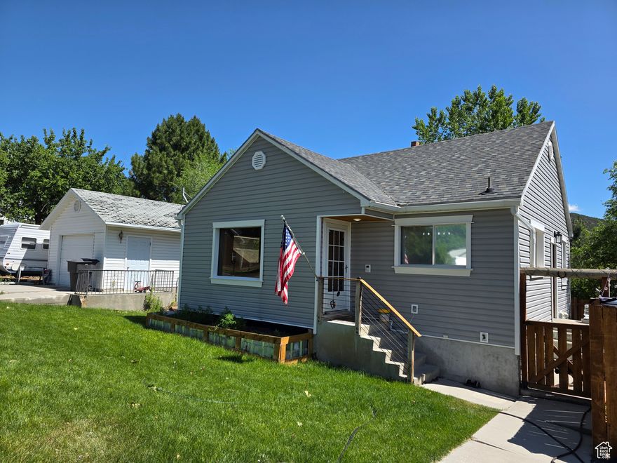 Discover 484 N Main Street featuring 1,584 sq. ft. of cozy living space on a 0.23-acre lot. Inside, enjoy a warm and inviting atmosphere with it's large family room and cozy fireplace, perfect to relax or entertain in.  The updated kitchen shines with it's granite countertops and newer appliances.  Downstairs you will find two additional bedrooms and 1 bath along with extra space for storage off the laundry room. Outside, take in stunning mountain and city views, plus off-street parking, a detached garage, and a shed for extra storage. Built in 1949, this home blends vintage charm with modern updates. Nestled in a quiet neighborhood, it's just minutes from local shops, dining, and outdoor recreation.  Come see it today-this gem won't last long!