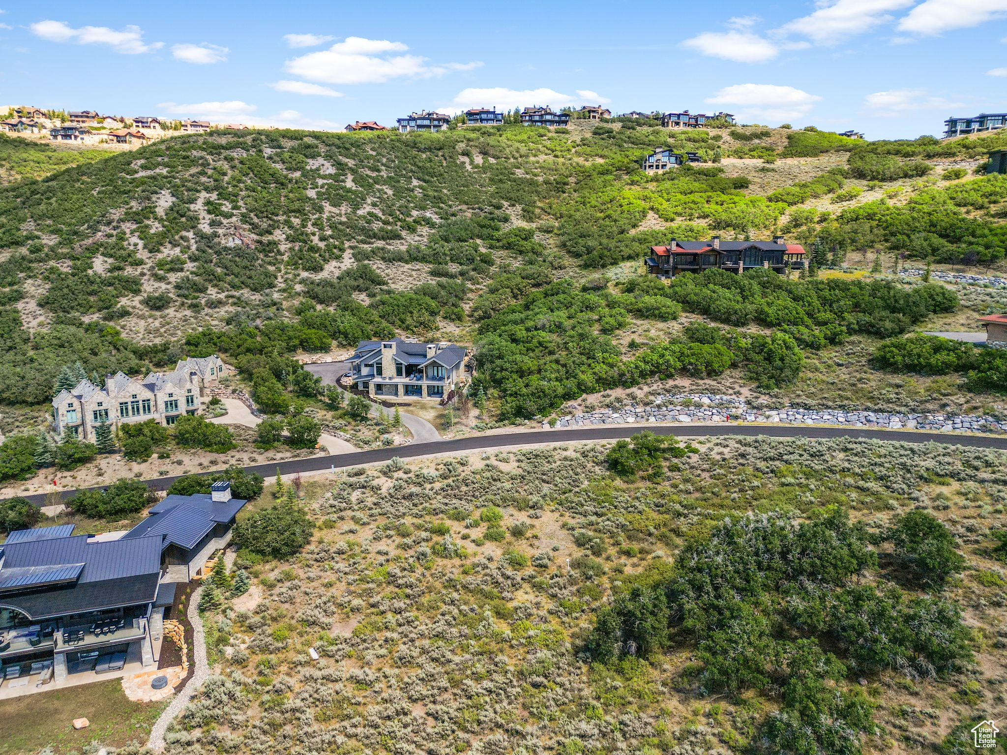 Nestled within easy reach of Promontory's northern gateway and I-80, this exceptional 1.07-acre homesite beckons for the creation of your dream residence. Minutes from the heart of downtown Park City, Promontory sprawls over 6,400 acres, delivering an incomparable, all-encompassing mountain club experience across all four seasons for individuals of every age. The allure of this location extends further with close proximity to three world-class ski resorts, and with the anticipated completion of Deer Valley East Village, the count rises to an impressive four resorts. Enriching this remarkable setting are Promontory's exclusive amenities, seamlessly blending outdoor adventure with luxurious leisure. Imagine days filled with championship golf rounds, horseback riding along scenic trails, and unwinding at the spa, all within this prestigious mountain community. As you envision building your dream home on this expansive lot, consider the unparalleled access to a private equestrian center, hiking and biking trails, and multiple clubhouses featuring fine dining and social events. Your architectural masterpiece will find its place amidst the breathtaking landscape and the array of Promontory amenities, where common area perks complement the surrounding natural beauty. This is not just a home; it's an invitation to a lifestyle where mountain tranquility meets the pinnacle of refined living. Explore the seamless blend of exclusive amenities and proximity to world-renowned ski destinations that define this extraordinary opportunity.