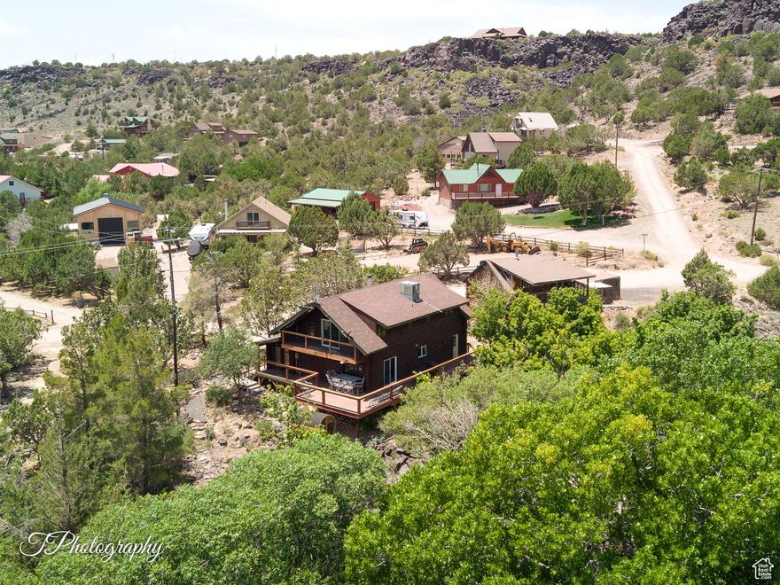 Enjoy year-round living in this updated Brookside cabin, tucked in the trees and backing to the Santa Clara River. Inside, you'll find a remodeled kitchen with new appliances and reverse osmosis, updated bathrooms, vinyl flooring throughout, PEX plumbing, fresh baseboards, live-edge wood shelving, and modern lighting. Take in the views from the refinished deck or the private balcony off the primary bedroom. Relax in the redwood barrel sauna in the evenings. Just steps from hiking and biking trails, this property is perfect for outdoor lovers. The detached 2-car garage includes an ADU (casita/apt) above, ideal for guests or as an income-producing rental. No HOA. Seller will contribute towards buyer closing costs with an accepted offer. Seller Financing Possible.
