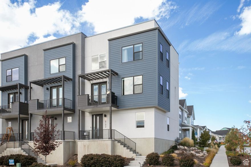 Experience Daybreak living at its finest in this spectacular, single-owner corner unit. Just three years old and impeccably cared for, the thoughtful design offers the spacious feel of a 2-story detached home. Relax on your porch with unobstructed views across the street. With its prime location and access to Daybreak's rich array of amenities, this home delivers an unbeatable lifestyle without the premium price tag.