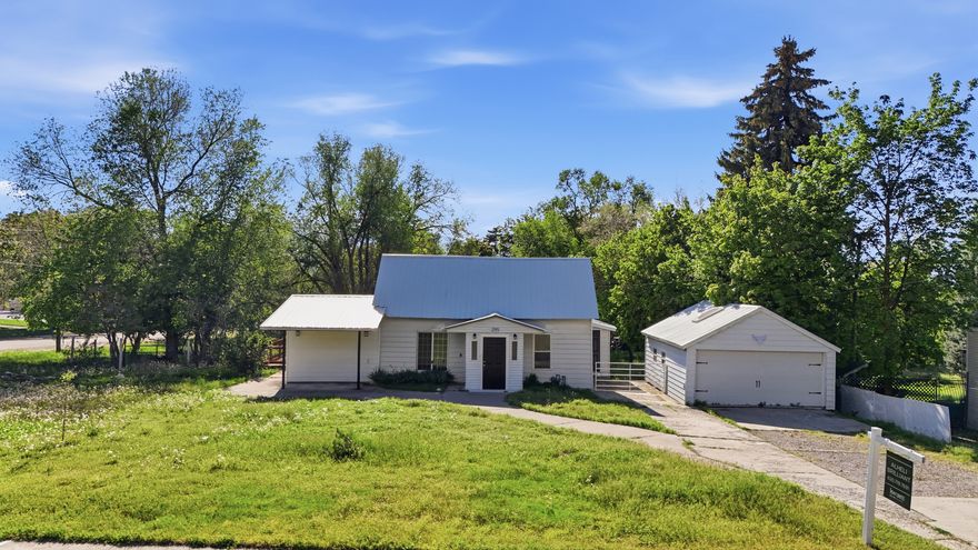 SELLER CONCESSIONS up to $5,000 offered! Don't miss this charming 4-bedroom, 2-bath home on a spacious .51-acre corner lot in Providence with 0.5 water shares included. Enjoy fresh paint, new carpet, an updated kitchen, skylights, mature fruit trees, a fenced yard, and a detached 2-car garage. With subdivision potential, this property offers both comfort and opportunity. Schedule your private showing today and see the possibilities for yourself! Buyer to verify all information.