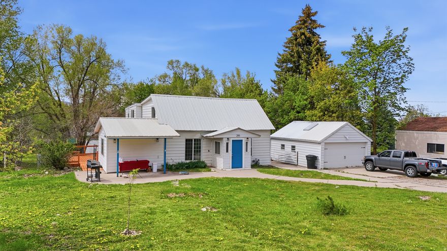 SELLER CONCESSIONS up to $5,000 offered! Charming 4-bed, 2-bath home on a .51-acre corner lot in Providence with 0.5 water shares. Features fresh paint, new carpet, updated kitchen, skylights, fenced yard, fruit trees, and detached 2-car garage. Subdivision potential adds value. Buyer to verify all info.