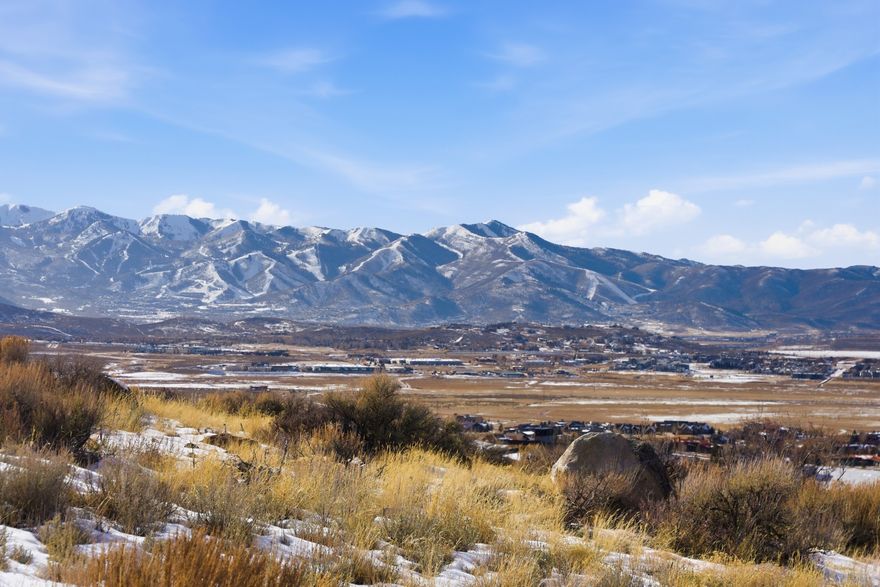 Unrivaled Estate Homesite in Promontory's Prestigious Elk Ridge Bluffs -- Set within Elk Ridge Bluffs, the community's most prestigious and limited estate neighborhood, this expansive 2.13-acre estate lot is perfectly positioned to offer unobstructed sweeping Wasatch Range views, year-round mountain exposure, and unparalleled privacy. With only 21 exclusive homesites, Elk Ridge Bluffs is the epitome of high alpine luxury living-where location, legacy, and lifestyle converge. This exceptional parcel includes fully approved Promontory Club building plans by renowned architectural firm 4C Design Group for a stunning 10,000 sq ft mountain modern masterpiece-saving you invaluable time and resources. Positioned to capture breathtaking panoramic views of the Wasatch Range, this site offers a rare combination of natural beauty, architectural vision, and developability. A Full Promontory Membership is available with the homesite, giving you access to world-class amenities immediately upon ownership. With the majority of Promontory's highest home values found along Bugle Trail, this is not just a homesite- it's a generational opportunity to build your legacy in one of Promontory's most elite enclaves. Exterior renderings are from available plans and depict a home that can be built.