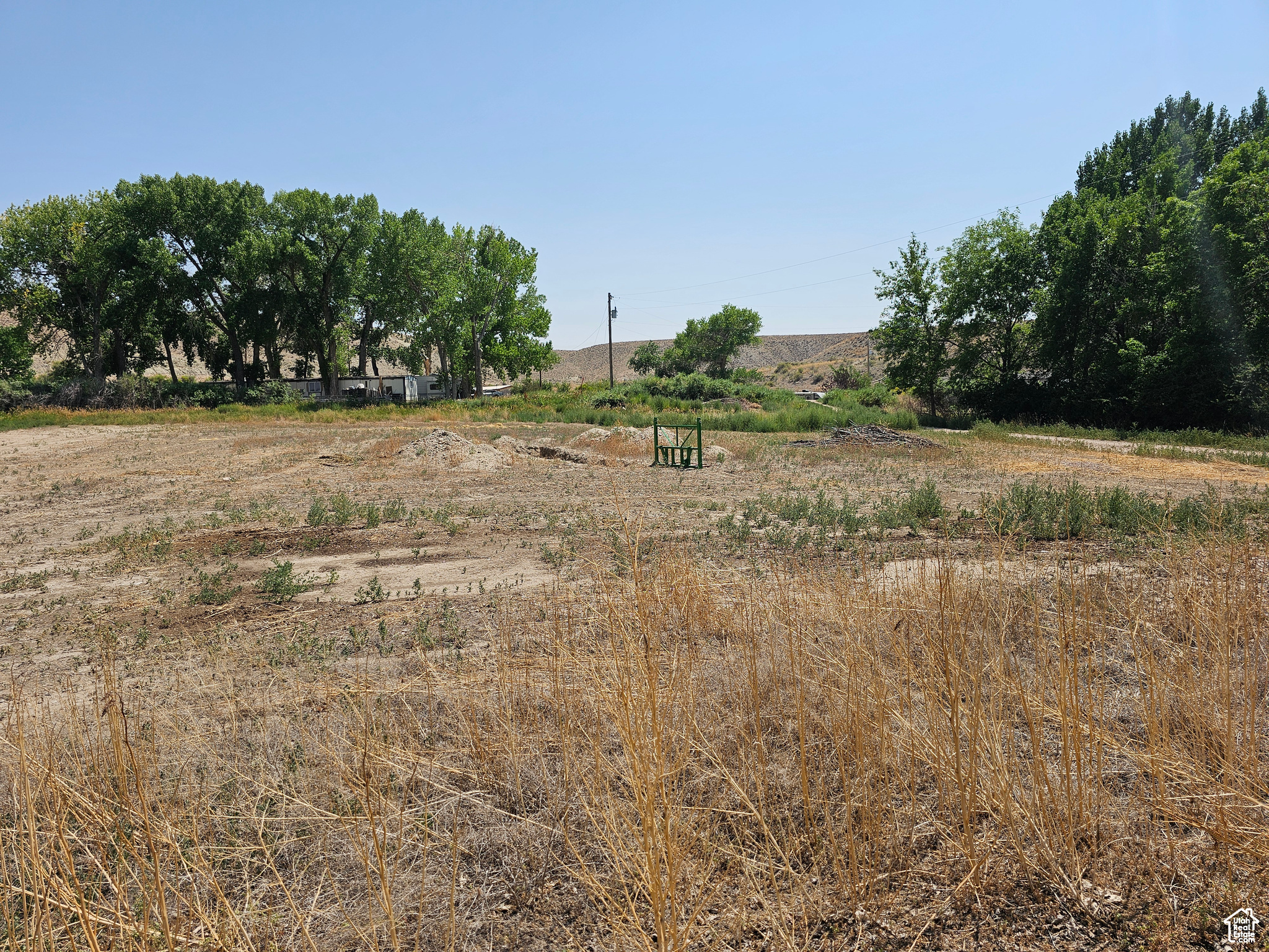 Bridgeland! A beautiful building site in a high demand, low supply area! Flat and buildable! Culinary water, power, and septic system available at buyer's expense. East of Duchesne in farm country! Great neighbors! Easy year 'round, access! Paved County maintained road is a school bus route. From Hwy 40, turn south on 9250 West. In approximately 1 mile, the road curves to the west. The property is on the south side of the curve.