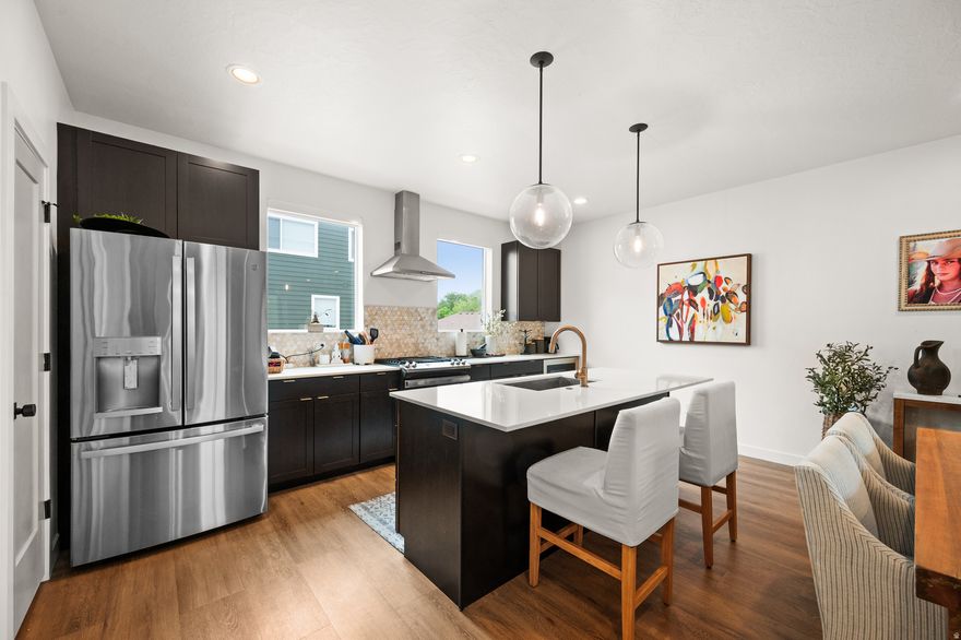 Welcome to the Alice, a C.W. Urban community in Layton. This beautiful townhome was built in 2023 and features 3 bedrooms and 3 bathrooms, sleek cabinets, Quartz countertops, modern lighting, and LVP vinyl flooring. This community also features green space, picnic tables, and a playground. The variety of retail centers and its proximity to both Ogden and Salt Lake City make Layton a hub for all activities in the surrounding suburbs.  The neighborhood is also close to Hill Air Force Base. So whether you're a commuter looking for a home with easy freeway access, or a lover of modern architecture, this home has it all.   Square footage figures are provided as a courtesy estimate only and were obtained from tax records.  Buyer is advised to obtain an independent measurement.