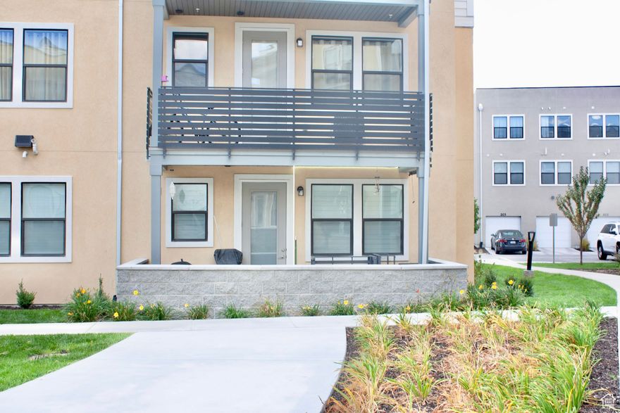 Experience elevated living at Jordan Bluffs in this stylish 3-bed, 2-bath main-level condo. With 1,360 sq ft of open-concept space, this home features luxury finishes, abundant natural light, and seamless flow from the spacious family room to the designer kitchen. Thoughtfully built with accessible design, it offers step-free entry, wide hallways, and easy mobility throughout.  Enjoy upscale touches like plantation shutters, premium flooring, and curated lighting. The primary suite offers a spa-inspired bath, while two additional bedrooms provide flexibility for guests or office space. Located in a vibrant community with clubhouse access, biking trails, pet-friendly amenities, and two parking spaces-plus quick access to I-15, shopping, and recreation.