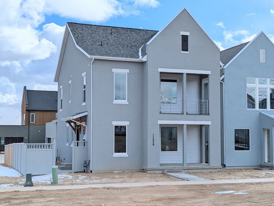 Brand new home featuring a FINISHED BASEMENT and a landscaped backyard enclosed by a 6-ft privacy fence. This property offers a perfect blend of modern design, comfort, and functionality. Step inside to discover 9-ft ceilings on every level, a main-floor dedicated office or bedroom ideal for remote work or study, and an upgraded kitchen complete with high-end finishes, perfect for both everyday living and entertaining. Upstairs, the spacious primary suite includes a private balcony and an en-suite bathroom with tile shower and spacious closet. Large windows throughout the home fill each room with natural light, enhancing the clean lines and open spaces of this thoughtfully designed layout. Located in the desirable Watermark Village, the home features green space out front and convenient access to parks, trails, and the Watercourse, all just minutes away. Estimated Feb-March 2026 Completion.