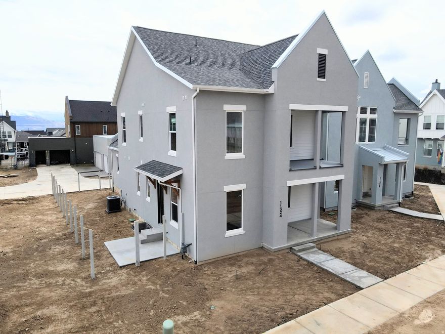 Brand new home featuring a FINISHED BASEMENT and a landscaped backyard enclosed by a 6-ft privacy fence. This property offers a perfect blend of modern design, comfort, and functionality. Step inside to discover 9-ft ceilings on every level, a main-floor dedicated office or bedroom ideal for remote work or study, and an upgraded kitchen complete with high-end finishes, perfect for both everyday living and entertaining. Upstairs, the spacious primary suite includes a private balcony and an en-suite bathroom with tile shower and spacious closet. Large windows throughout the home fill each room with natural light, enhancing the clean lines and open spaces of this thoughtfully designed layout. Located in the desirable Watermark Village, the home features green space out front and convenient access to parks, trails, and the Watercourse, all just minutes away. Estimated Feb-March 2026 Completion.