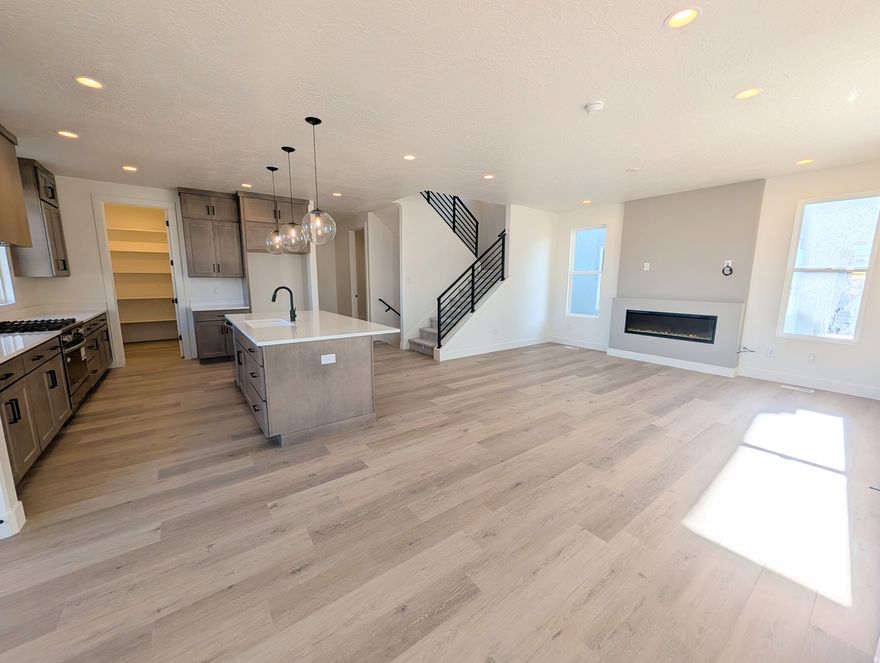 Brand new home featuring a FINISHED BASEMENT and a landscaped backyard enclosed by a 6-ft privacy fence. This property offers a perfect blend of modern design, comfort, and functionality. Step inside to discover 9-ft ceilings on every level, a main-floor dedicated office or bedroom ideal for remote work or study, and an upgraded kitchen complete with high-end finishes, perfect for both everyday living and entertaining. Upstairs, the spacious primary suite includes a private balcony and an en-suite bathroom with tile shower and spacious closet. Large windows throughout the home fill each room with natural light, enhancing the clean lines and open spaces of this thoughtfully designed layout. Located in the desirable Watermark Village, the home features green space out front and convenient access to parks, trails, and the Watercourse, all just minutes away. Estimated Feb-March 2026 Completion.