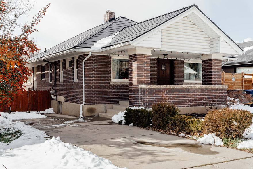 This Arts & Crafts bungalow sits just blocks away from the many great eateries and establishments emerging along 1100 East. From Bartolo's and Liberty Heights Fresh and Kyoto Japanese Restaurant to the recently opened Kiitos Brewing Bar, the best of the neighborhood is right at your doorstep. The charm of this brick beauty shines through in its rich gumwood trim, original fireplace, and a spacious dining room designed for lingering meals with friends. The generous kitchen features stainless steel appliances, slate floors, and abundant storage-perfect for both daily living and entertaining. On the main, you'll find two ample bedrooms and a full bath while the remodeled lower level boasts tall ceilings, a third bedroom and a second, luxurious bathroom. There's also a wet bar and living area just right for that home theater. Recent updates include most upstairs windows replaced, an upstairs bathroom refresh, xeriscaping and a Tesla Solar Roof. This high-capacity, fully integrated system is designed for full-home backup and energy independence. Spring is in the air, and if you're in the market for a lovingly cared for home in just the right spot, now is the time. Homes like this don't last long.