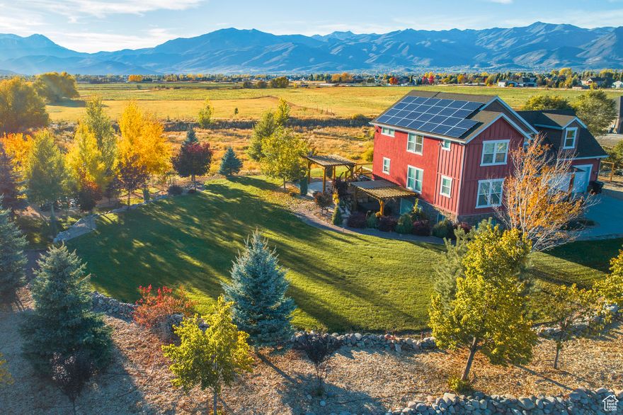 Tucked away at the end of a quiet cul-de-sac on 3 private acres, this stunning custom home offers unobstructed views of open meadows and majestic Mount Timpanogos.  Inside, you'll find solid hardwood floors, two cozy fireplaces, and an open kitchen featuring Whirlpool appliances, granite and butcher block countertops, and a brand-new Bosch dishwasher. Smart home features include: Alexa-enabled thermostats, a programmable drip irrigation system, and exterior lighting that automatically adjusts with sunrise and sunset. Upstairs, the home features three spacious bedrooms-including the primary suite-all with exceptional views and generous storage. There is also a bonus office/family room above the garage. The finished basement offers rental potential or private guest space, including a home theater.  Step outside to enjoy the freshly stained deck, an outdoor fire pit, manicured mature landscaping, and a thriving garden oasis complete with peach, apple, pear and cherry trees, strawberry and raspberry patches, vegetables, herbs, and grapevines. Behind the home is a beautiful retention basin that will provide a natural barrier to any development that will come behind the property and protect those views for years to come.  Located near Old Mill Elementary-ranked among the top 5 elementary schools in the state-and just 10 minutes from central Heber. Enjoy year-round adventure with golf, lakes, fishing, hiking, biking, and ATV trails all nearby. World-class skiing in Park City is just 30 minutes away, and Salt Lake City International Airport is under an hour's drive.  This rare opportunity combines quiet seclusion, modern convenience, and long-term potential-all with breathtaking views in every direction.  Sale subject to seller closing on replacement home (currently under contract).