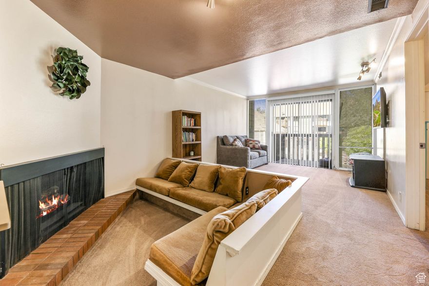 Charming mid-century condo in the heart of Taylorsville! Bright open layout with natural light, built-in couch, and fireplace. Features ample storage, washer/dryer, and all appliances. Enjoy a year-round indoor pool, gym, clubhouse, and covered parking!  Square footage figures are provided as a courtesy estimate only and were obtained from county records.  Buyer is advised to obtain an independent measurement.