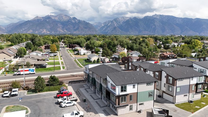 PRICED TO SELL!! Newly constructed Sandy Utah townhome!! This large 3 bed 3 bath End Unit is nearly 2,200 sqft. with 3 well designed floors all enjoying views of the Wasatch Range. Located near shopping, schools, employment and recreation. Ski Snowbird, Alta, Brighton and Solitude within minutes. Easy access to the I-15 offers quick access to downtown Salt Lake and thriving Silicon Slopes! This highly upgraded home boasts an island kitchen with white shaker slow-close cabinetry, quartz counter tops and stainless steel appliances including an LG Refer, built-in microwave, dishwasher and large single bay SS sink. Appreciate easy maintenance and the clean look of laminate flooring throughout the home. Bask in abundant natural light shinning through large dual pane windows with 8' header heights. Enjoy parking in the attached 2 car garage with smart opener and insulated garage door...and so much more! **Come see it, Love it and Make in your own!!**