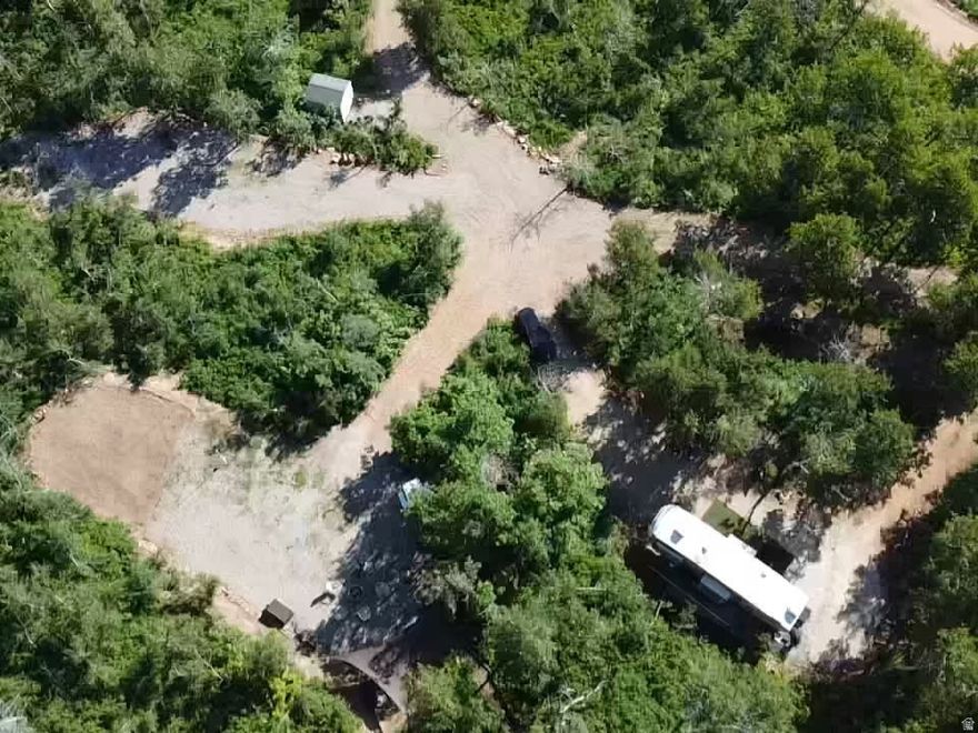 One of the nicest developed lots on the mountain. Amazing Views! Lot has year round drinking water, several different  trailer spots, four septic cleanouts a Tuff shed. and developed trails.  This is your opportunity to own a get-away that Comes with a large amount of wildlife including Moose, Deer, beaver, hummingbirds and more. 10 miles off HWY 39 in Huntsville where it is rare 'not to' see wildlife with every visit. This is a perfect getaway to be able to relax by the fire and enjoy the amazingly bright stars at night while listening to owls hooting off in the distance. Lot does have a large flat area to park an RV or build your dream cabin. Sunridge has several areas of common grounds that include streams, a lake and a large covered Bowery. Sunridge is a gated community and you will need gate access to see the property. Lot is accessible by snow machines in the winter and anything you choose to drive up to the lot in the summer. Don't miss this chance to own an amazing piece of Real Estate!