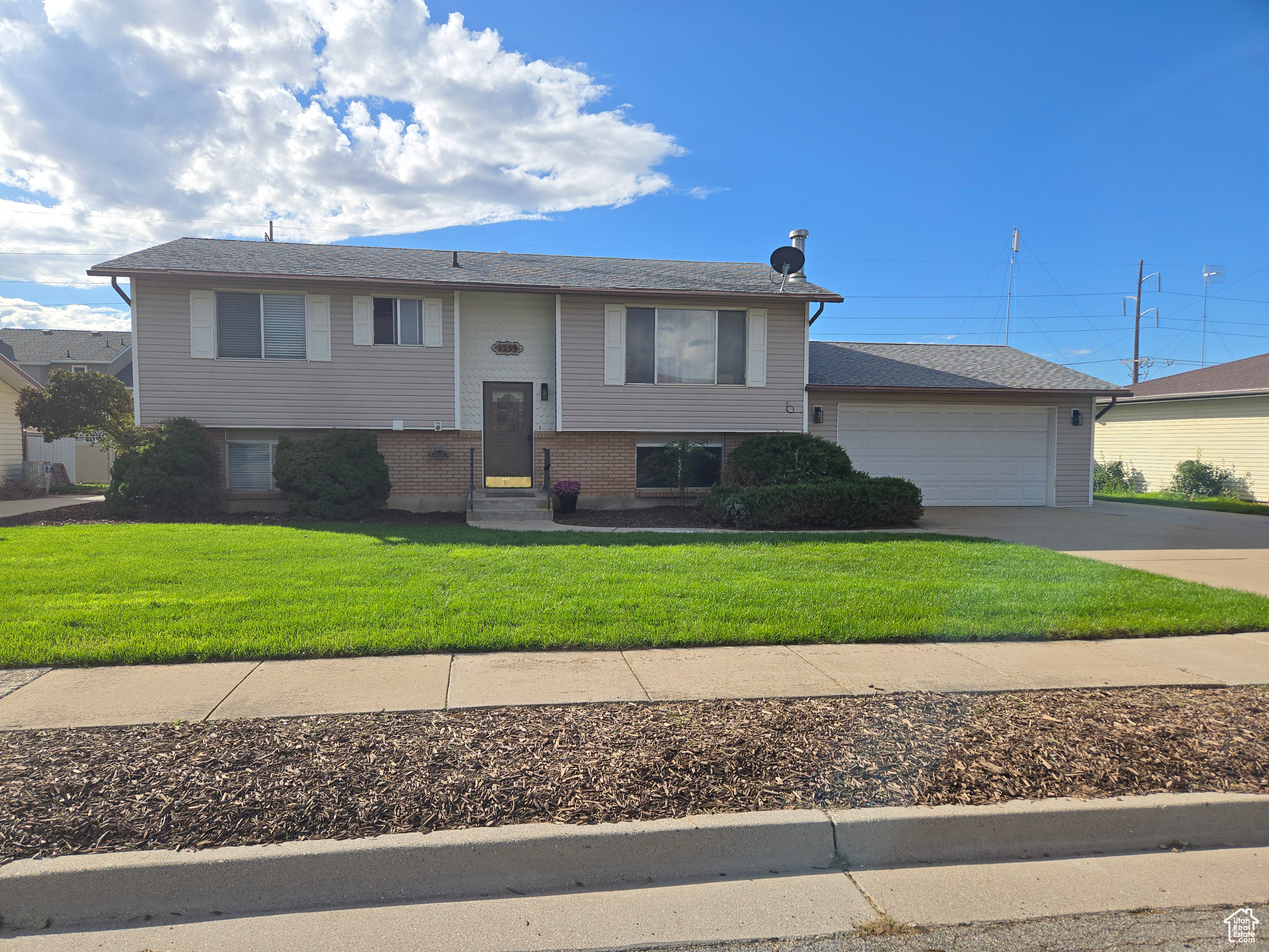 Welcome home! This beautiful, bright, airy, open layout home, features new: paint, carpet, lighting, bathrooms, kitchen and appliances (the fridge is a scratch/dent). She will love the design details and new kitchen. He will appreciate the extra deep garage with work bench and shop area, plus a mancave! Come make memories in this wonderful, friendly, neighborhood, located near EVERYTHING! 3 minutes to I-15. Mid-town Crossing takes you to shopping and restaurants in just 5 minutes. The RV parking, two-car garage, and many upgrades, make this home a great value!